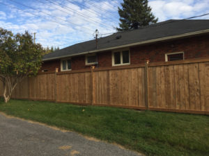 Wood Fence by Deluxe Fencing and Decks